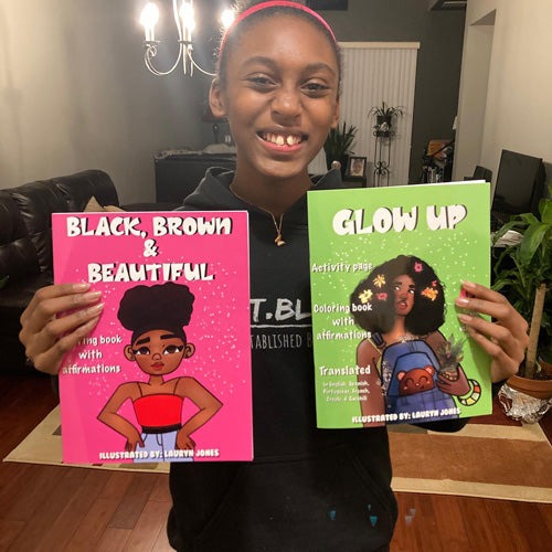 Sumer Strawbree's Photo Holding Her Books - "Black, Brown, and Beautiful" and "Glow up".